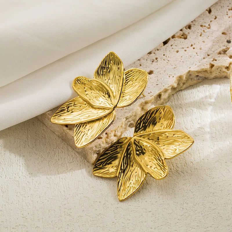 Aretes media flor